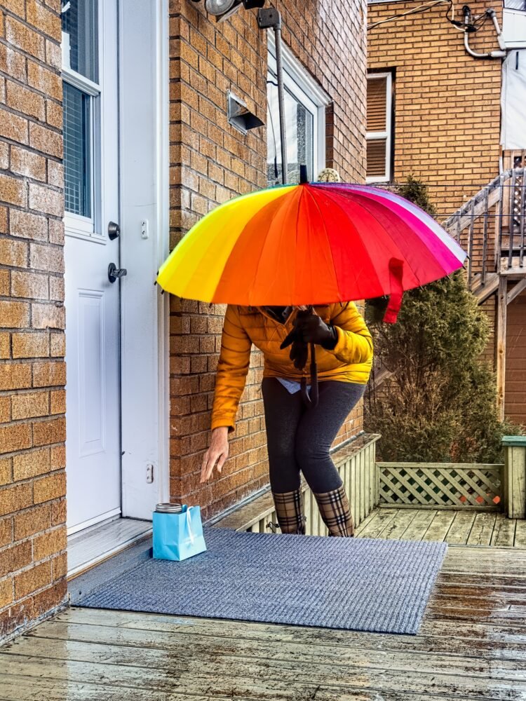person on doorstep gift