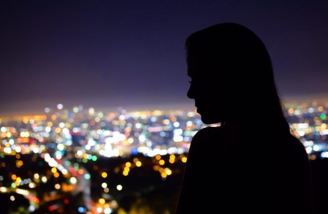 woman looking out over city