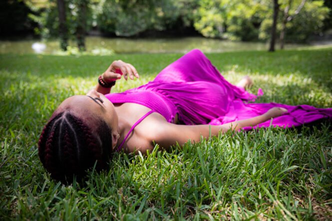 girl laying in grass